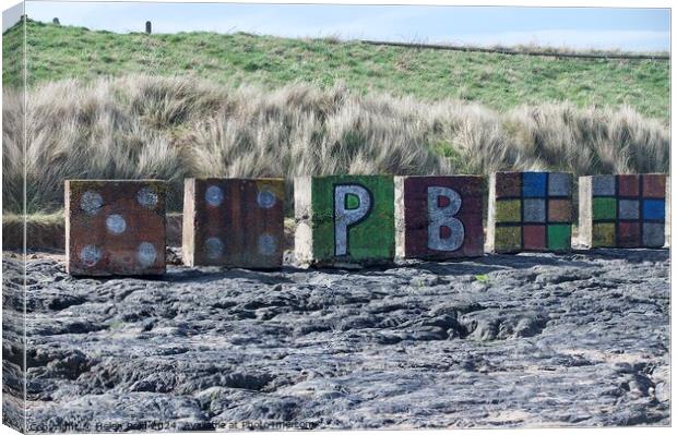 Beach art sculpture Bamburgh Beach Northhumberland  Canvas Print by Helen Reid