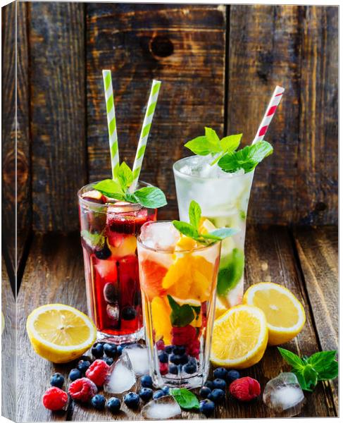 Fruit drinks on wooden background Canvas Print by CC Designs