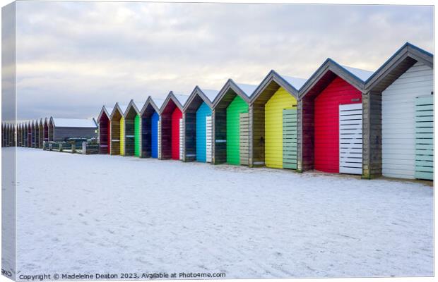 Beach Huts in the Snow Canvas Print by Madeleine Deaton
