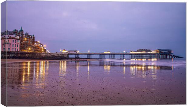 Cromer Pier reflections  Canvas Print by Bryn Ditheridge
