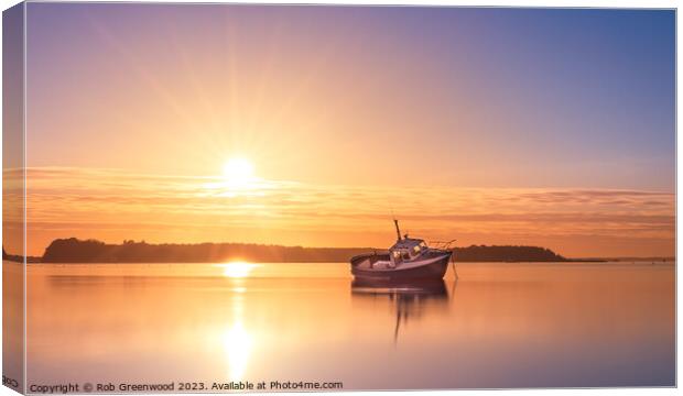 Lone boat at sunset Canvas Print by Rob Greenwood