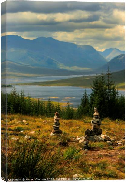 Stone Stacks at The 5 Sisters of Kintail Canvas Print by Simon Gladwin