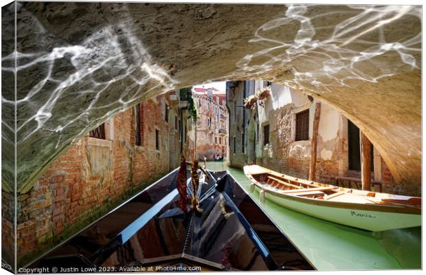 Venetian Canal Canvas Print by Justin Lowe
