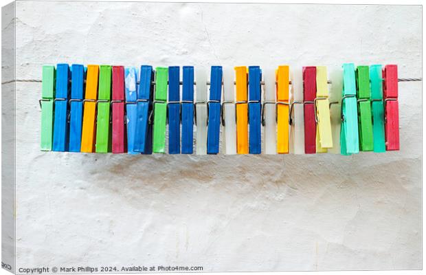 Clothes peg colours Canvas Print by Mark Phillips