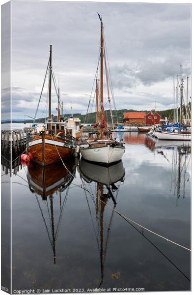 Boat reflection in the fjord Canvas Print by Iain Lockhart