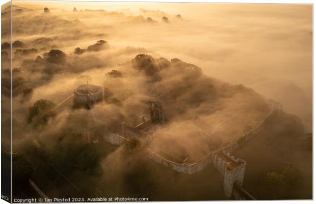 Carisbrooke Castle at dawn mist Canvas Print by Ian Plested