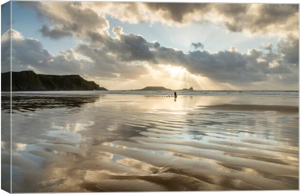 Sunbeams over Rhossili Bay Canvas Print by Robert Canis