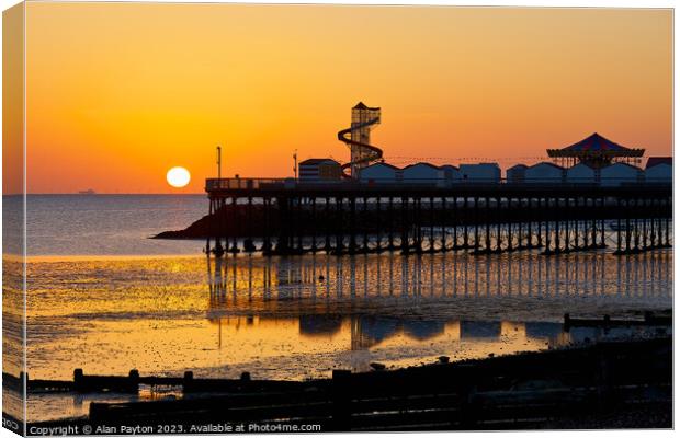 Sunrise and reflections at Herne Bay Pier Canvas Print by Alan Payton