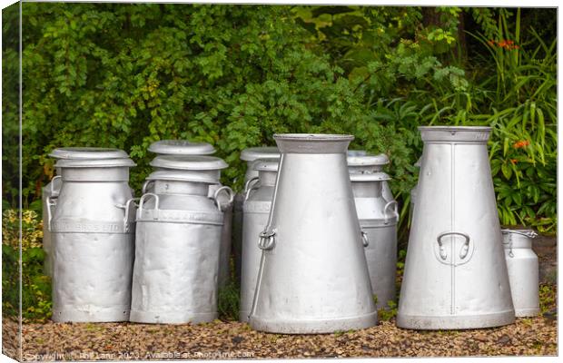 Old milk churns at Arley station Canvas Print by Phil Lane