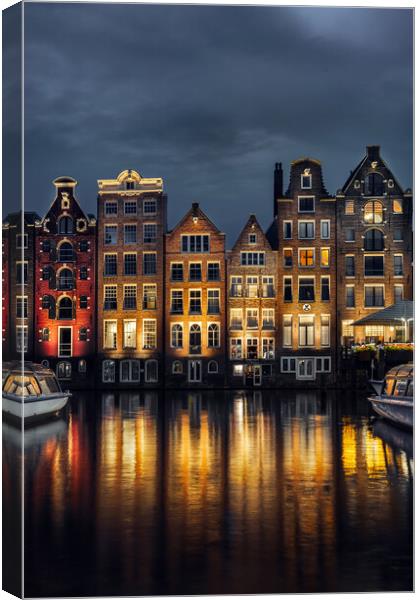 Night dancing houses at Amsterdam canal Damrak, Holland, Netherl Canvas Print by Olga Peddi