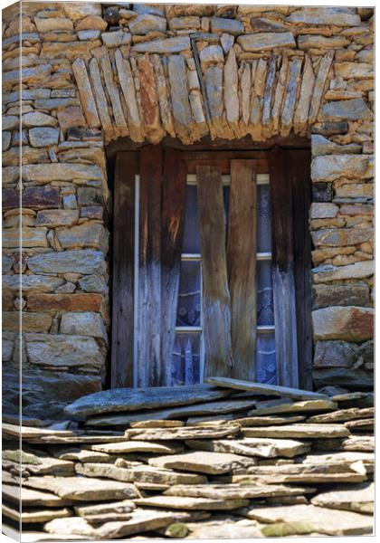 Building doorwindows Canvas Print by Olga Peddi