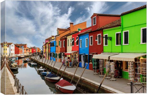 Colorful houses and canal on Burano island, near V Canvas Print by Olga Peddi