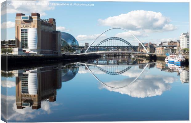 Bridges reflected in the river Tyne  Canvas Print by Bryan Attewell