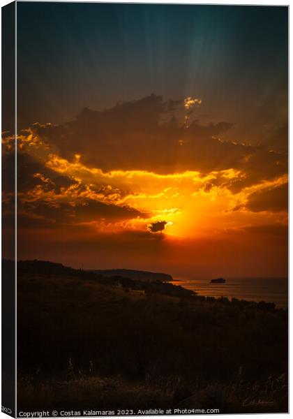Sunrise behind the clouds Canvas Print by Costas Kalamaras