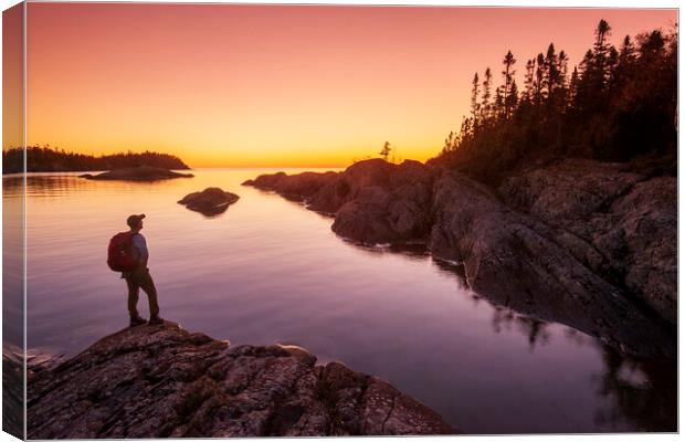 hiker along shoreline Canvas Print by Dave Reede