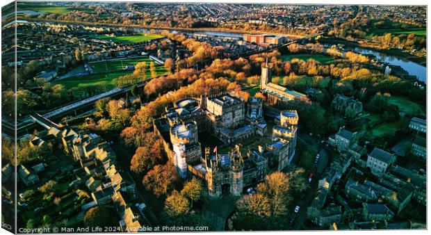 Aerial view of a historic Lancaster castle amidst a lush green landscape with surrounding urban area during golden hour. Canvas Print by Man And Life