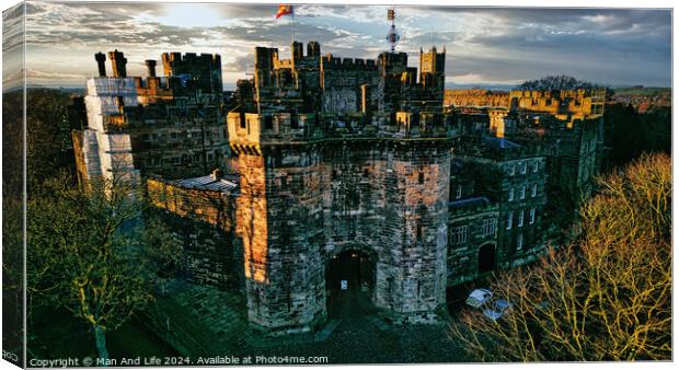 Historic medieval Lancaster castle at sunset with vibrant sky and lush greenery. Canvas Print by Man And Life