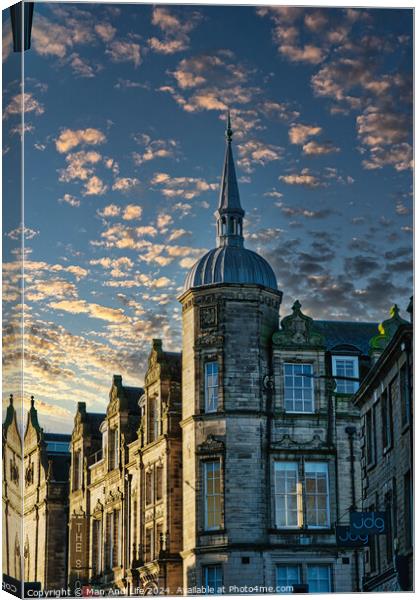 Historic building with a spire against a dramatic sky with golden sunset clouds in Lancaster. Canvas Print by Man And Life