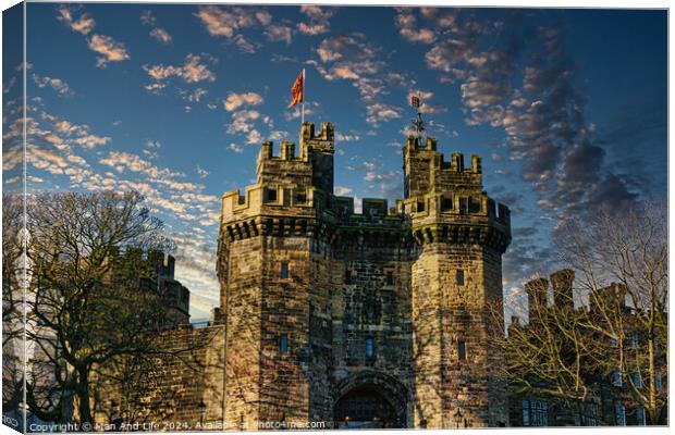 Historic stone castle with towers against a blue sky with scattered clouds at sunset in Lancaster. Canvas Print by Man And Life