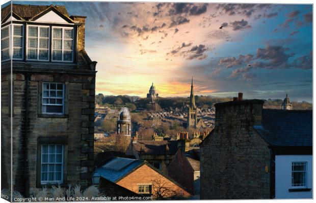Picturesque sunset over a historic cityscape with silhouetted buildings and dramatic clouds in Lancaster. Canvas Print by Man And Life