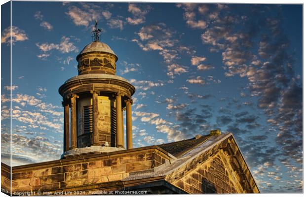 Historic stone building with a dome under a blue sky with scattered clouds at sunset in Lancaster. Canvas Print by Man And Life