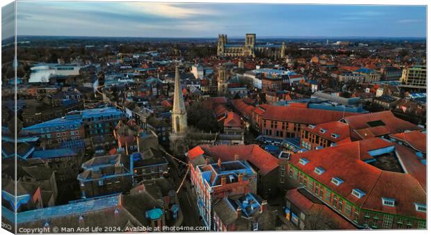 Aerial view of a historic city at dusk with prominent cathedral and urban landscape in York, North Yorkshire Canvas Print by Man And Life