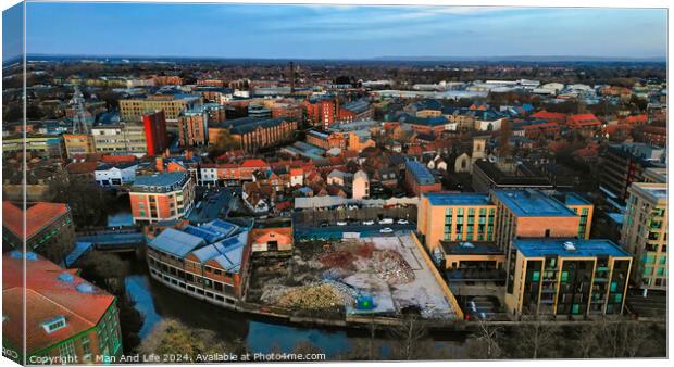 Aerial view of a modern cityscape during sunset with buildings and a river in York, North Yorkshire Canvas Print by Man And Life