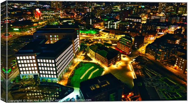Aerial night view of a vibrant cityscape with illuminated streets and buildings in Leeds, UK. Canvas Print by Man And Life