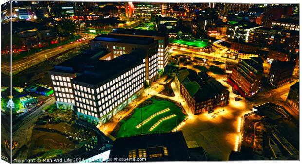 Aerial night view of an illuminated urban landscape with buildings and streets in Leeds, UK. Canvas Print by Man And Life