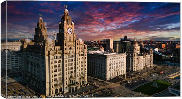Aerial view of iconic Liverpool waterfront buildings at sunset with dramatic sky. Canvas Print by Man And Life