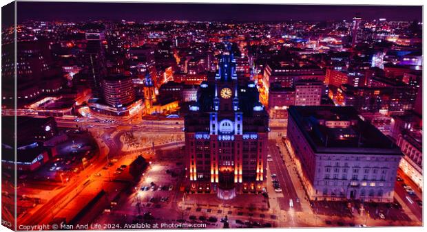Aerial night view of a cityscape with illuminated buildings and streets, showcasing urban architecture and vibrant city life in Liverpool, UK. Canvas Print by Man And Life