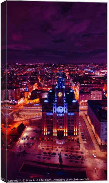 Aerial night view of a cityscape with illuminated buildings under a purple sky in Liverpool, UK. Canvas Print by Man And Life