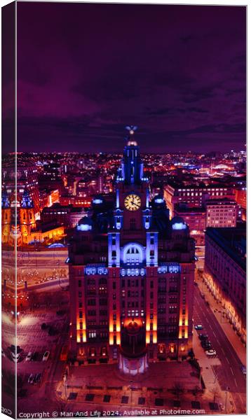 Aerial night view of an illuminated historic building in an urban landscape with vibrant purple skies in Liverpool, UK. Canvas Print by Man And Life