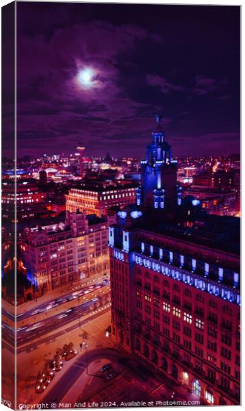 Cityscape at night with illuminated buildings under a moonlit sky in Liverpool, UK. Canvas Print by Man And Life