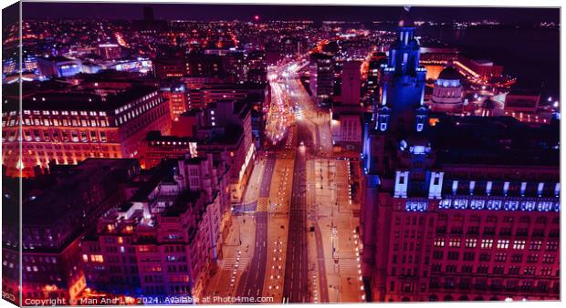 Aerial night view of a bustling cityscape with illuminated streets and urban architecture in Liverpool, UK. Canvas Print by Man And Life