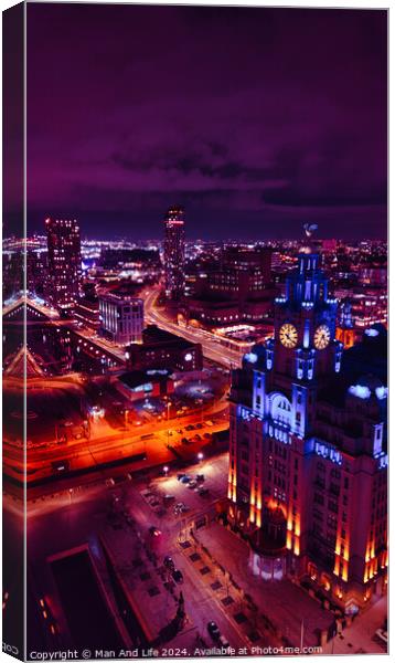 Aerial night view of a vibrant cityscape with illuminated streets and buildings under a purple sky in Liverpool, UK. Canvas Print by Man And Life