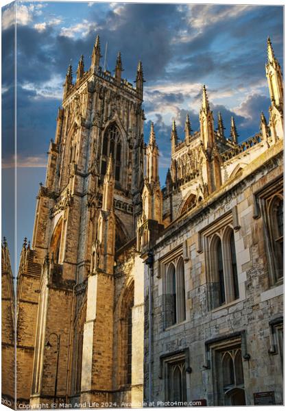 Gothic cathedral against a dramatic sky at sunset, showcasing intricate architecture and historical grandeur in York, UK. Canvas Print by Man And Life