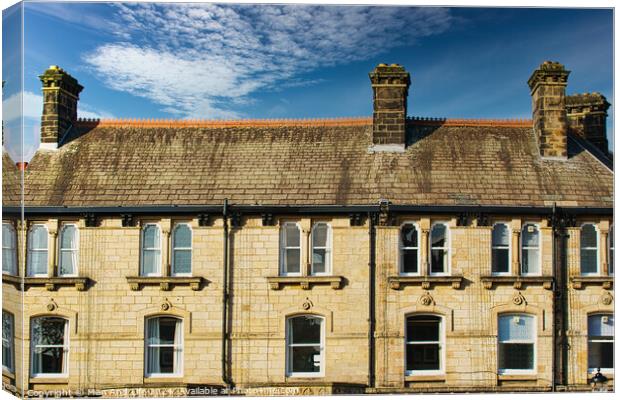 Traditional brick row houses under blue sky with wispy clouds in Harrogate, England. Canvas Print by Man And Life