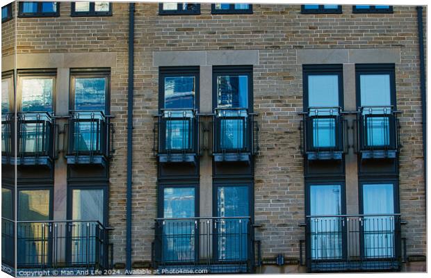 Modern apartment building facade with symmetrical windows and balconies, urban architecture background in Harrogate, England. Canvas Print by Man And Life