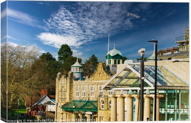 Sunny day over historic buildings with blue sky and fluffy clouds in Harrogate, England. Canvas Print by Man And Life