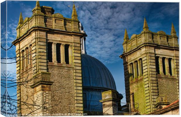 Twin stone towers against a blue sky with dramatic clouds, architectural detail in Harrogate, England. Canvas Print by Man And Life