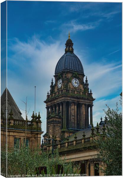 Victorian architecture of an ornate clock tower against a blue sky with clouds in Leeds, UK. Canvas Print by Man And Life