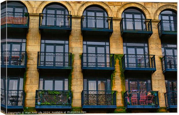 Facade of a vintage building with ornate windows and balconies in Leeds, UK. Canvas Print by Man And Life