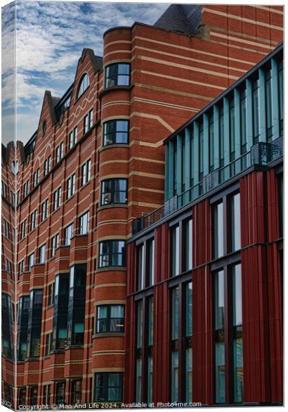 Modern urban architecture with red brick and glass facade against a cloudy sky in Leeds, UK. Canvas Print by Man And Life
