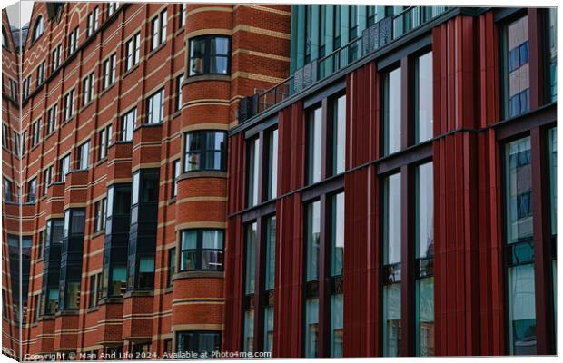 Modern building facade with a pattern of red and brown rectangular windows and panels, architectural background in Leeds, UK. Canvas Print by Man And Life