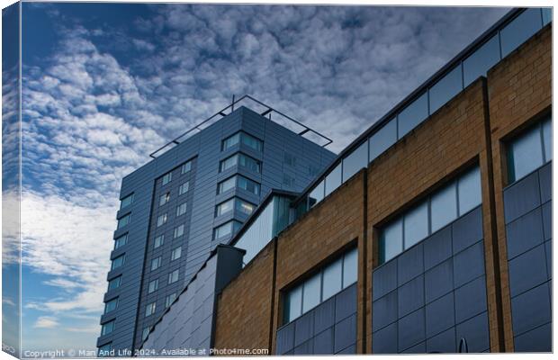 Modern urban architecture with blue sky and clouds in Leeds, UK. Canvas Print by Man And Life