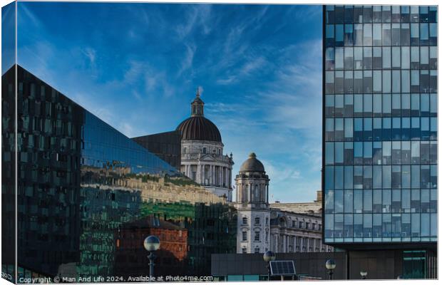 Urban contrast with old dome architecture beside modern glass building under a blue sky with wispy clouds in Liverpool, UK. Canvas Print by Man And Life