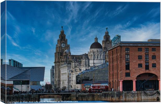 Liverpool waterfront with historic buildings and blue sky Canvas Print by Man And Life