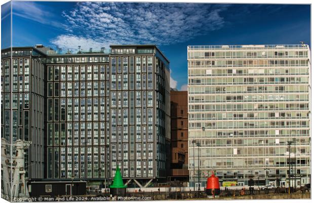 Modern office buildings with reflective glass facades under a blue sky with scattered clouds in Liverpool, UK. Canvas Print by Man And Life