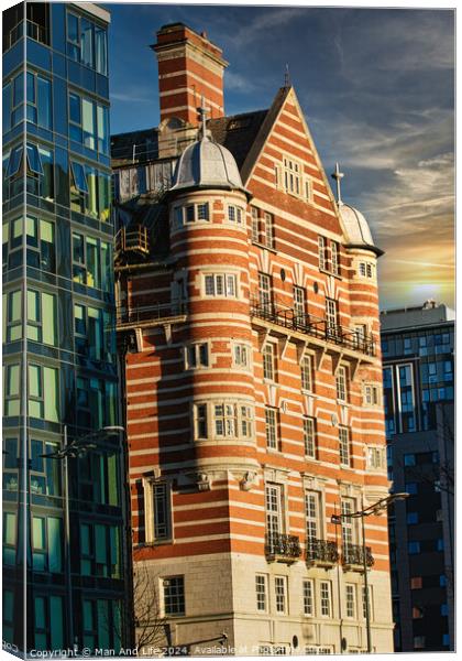 Traditional red brick building juxtaposed with modern glass facade architecture at sunset in Liverpool, UK. Canvas Print by Man And Life